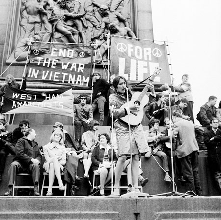 American folk singer Joan Baez performs at an anti-Vietnam War demonstration in London