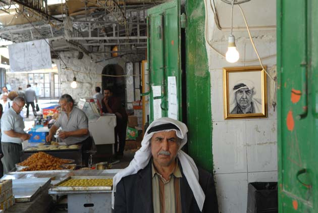 A stallholder with his portrait
