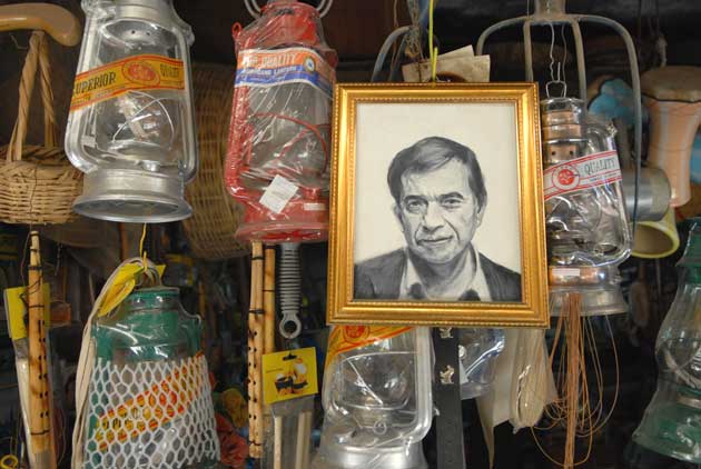 One of the portraits hangs in a shop