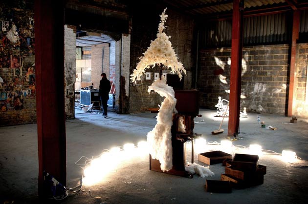 View of Make Believe exhibition, including Jodie Careys' Furniture Arrangement II, in an old warehouse, near Shoreditch High Street