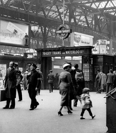 Travellers pass through Waterloo station in 1967