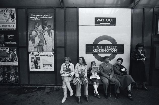 Passengers at High Street Kensington station wait for their train in 1979