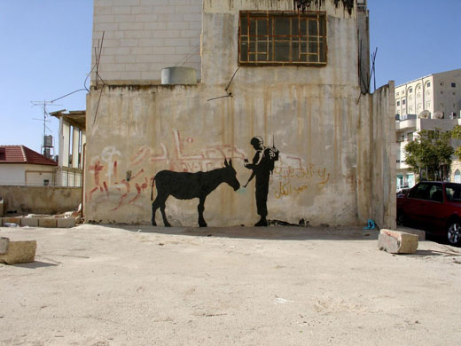 صور لرسومات على الجدار العنصري الفاصل..اكبر مجموعه من الصور على الانترنت... GD5512091@Handout-photo-of-artw-6534