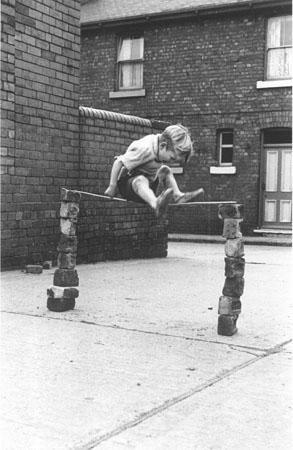 boy playing in the street