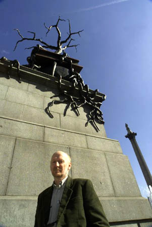 Bill Woodrow in front of his sculpture 'Regardless of History'