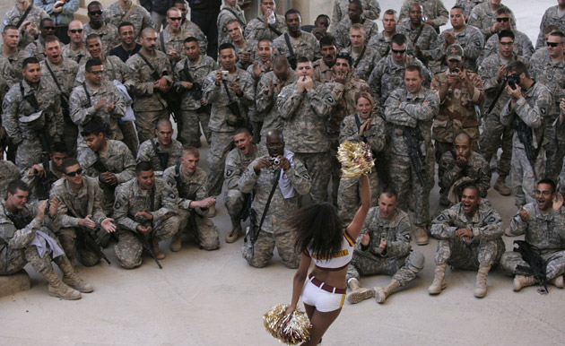 Soldiers at Patrol Base Dragon watch a cheerleading display 