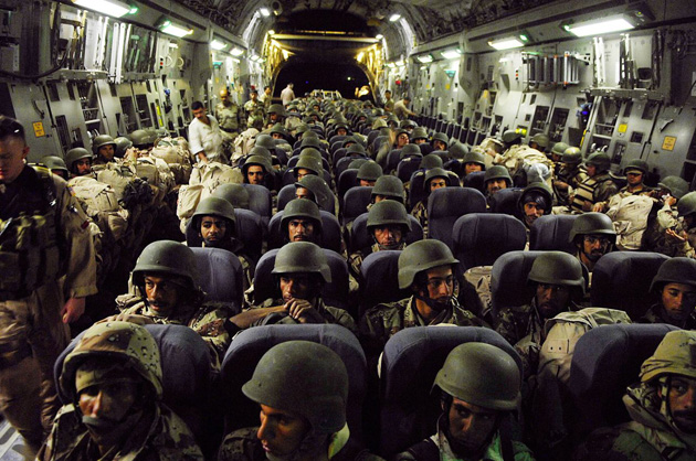 Iraqi army soldiers sit in a US Air Force C-17 Globemaster III aircraft at New Al Muthana Air Base in Iraq