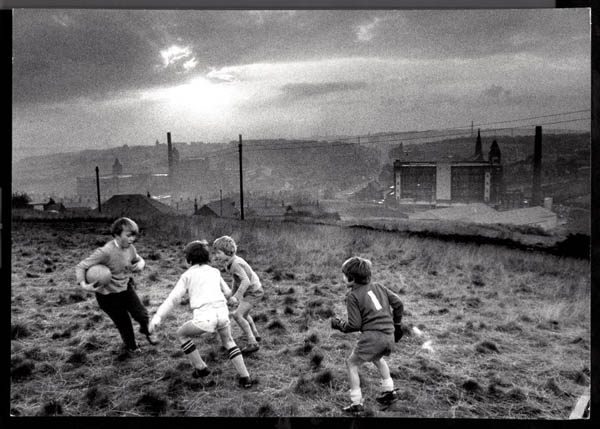 Boys playing football in Oldham, 1982