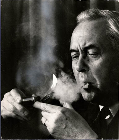 Harold Wilson lighting his pipe at the Huyton Labour Club in 1974