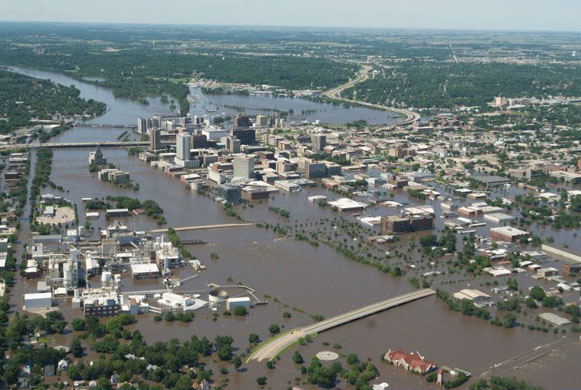 An aerial image of downtown shows flood-affected areas in Cedar Rapids