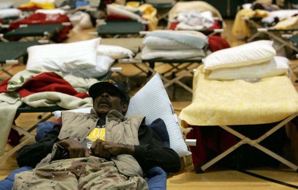 Ronald Austin rests on a cot at a Red Cross shelter in Cedar Rapids 
