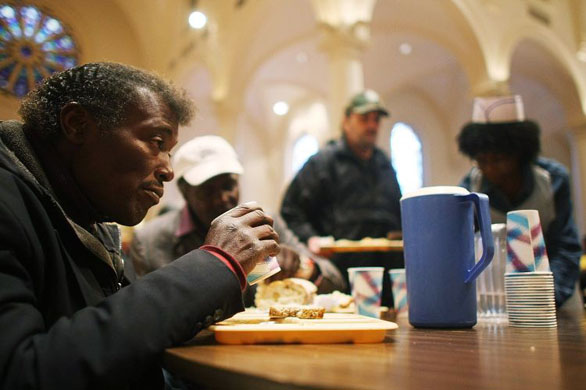 April 29 2008: A man eats a free lunch at the Holy Apostles Soup Kitchen in New York City