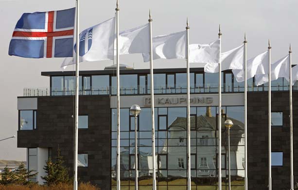 The Iceland flag flies next to the headquarters of Kaupthing Bank in Reykjavik