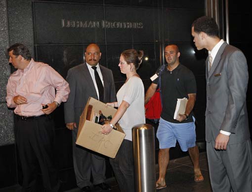 Lehman Brothers employees carry boxes out of the New York offices