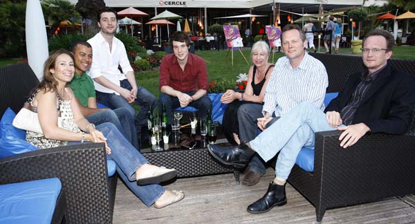 Attendees relax on the sofas