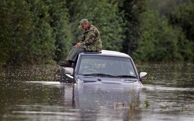 Man waits to be rescued in the floods