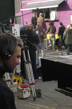 The director watches over a take