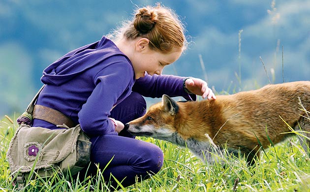 Bertille Noël-Bruneau and furry friend in The Fox and the Child