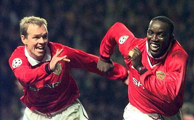 Henning Berg celebrates with Dwight Yorke