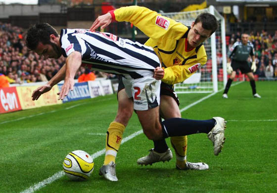Carl Hoefkens of West Bromwich Albion is challenged by Adam Johnson of Watford