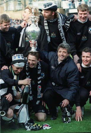 Manager Kevin Keegan celebrates with players after winning the Division One Championship Cup