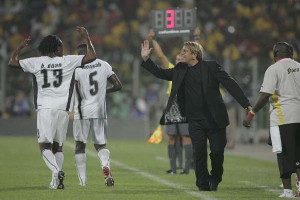 Ghana coach Claude le Roy cheers his team after victory in the opening game