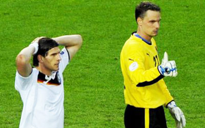 Mixed reactions from the German striker Mario Gomez, left, and the Austrian goalkeeper Juergen Macho to an early missed chance. Photograph: Tannen Maury/EPA