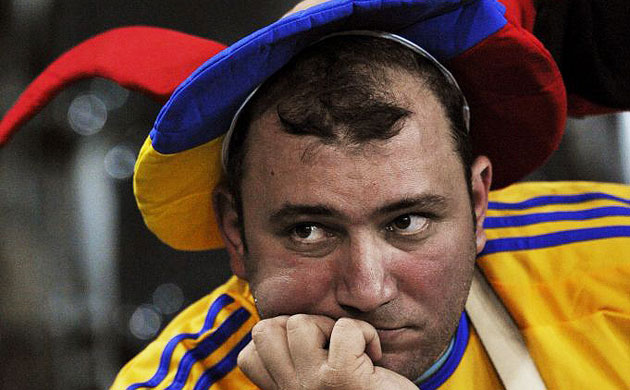 A distraught Romania fan
