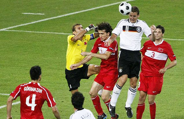 Miroslav Klose heads in Germany's second