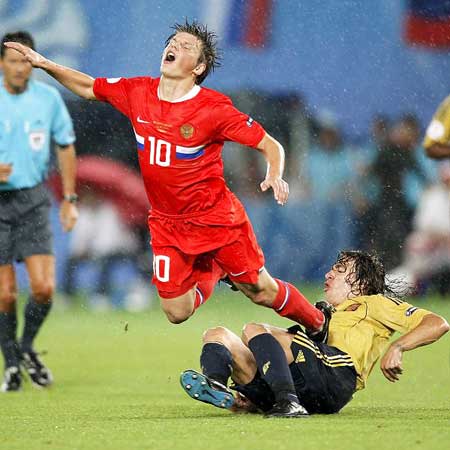 Andrei Arshavin and Carles Puyol