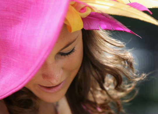 Suzanne Murphy arrives in an Edwina Ibotson hat