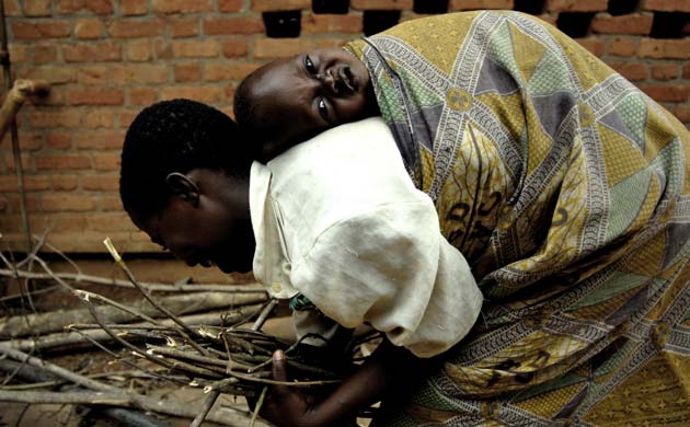 Woman carrying child