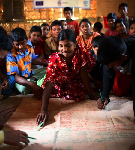 Children participate in a monthly meeting of the disaster management project run by Plan Bangladesh