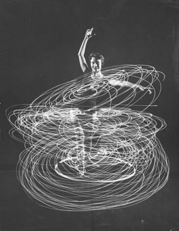 A multiple exposure of a woman playing with a hula hoop