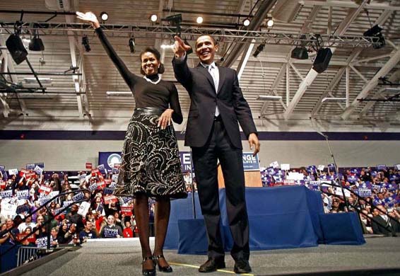 Barack and Michelle Obama at a primary night rally at Nashua South High School, New Hampshire 2008