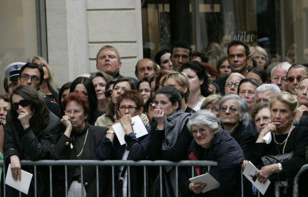 Onlookers stand outside the church during YSL funeral in Paris 