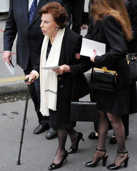 The mother of Yves Saint Laurent Lucienne Mathieu-Saint Laurent (L) the church after her son's funeral mass in Paris