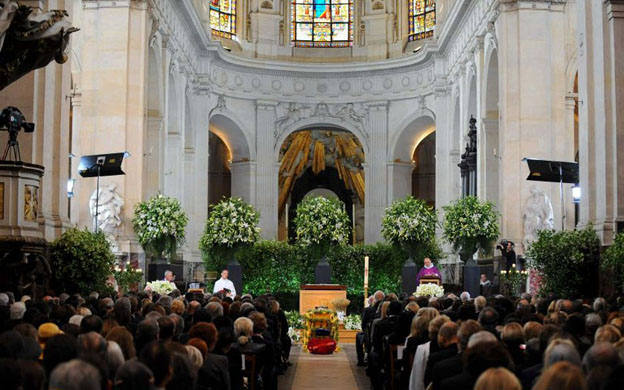 Mourners attend the funeral service inside the church of Saint Roche 