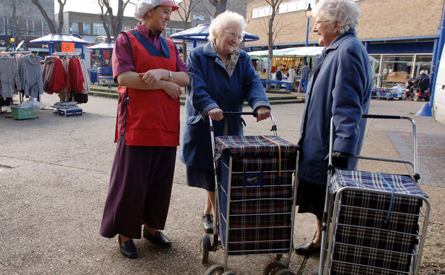 Elderly ladies with tartan shopping trolleys