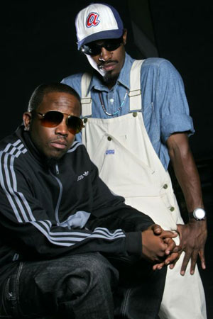 Andre 3000 in white dungarees