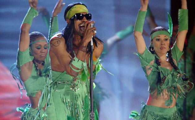 Andre 3000 in green tassels