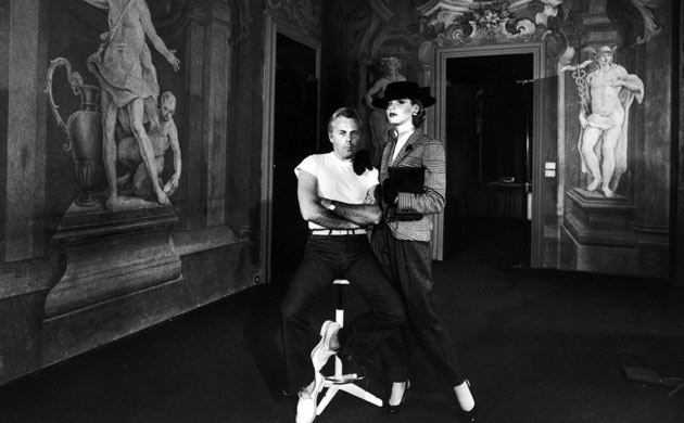 Giorgio Armani poses with a model in 1979