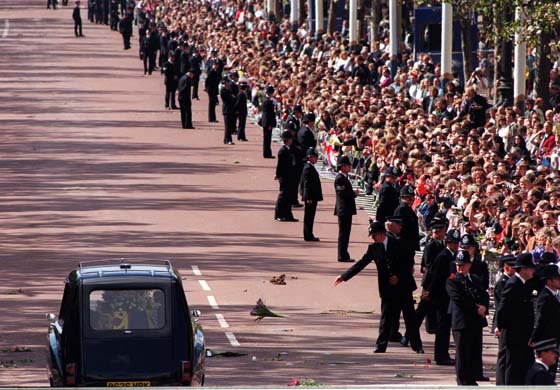A policeman throws flowers