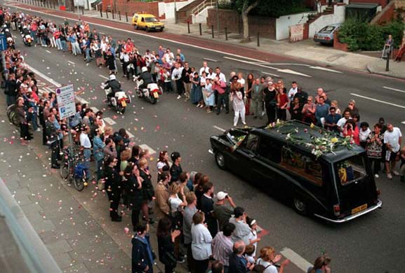 Mouners line the roads
