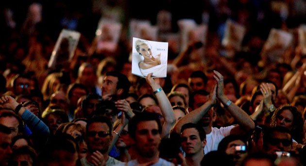 A fan holds up a picture of Diana, Princess of Wales