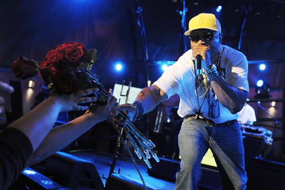 LL Cool J hands flowers to fan