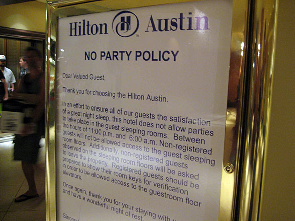 Hilton's no party policy sign
