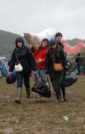 Festival goers in the rain