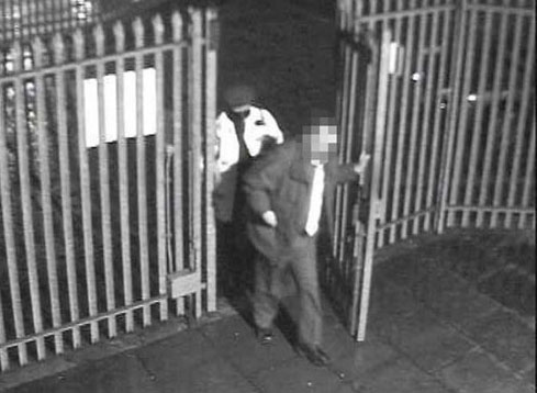 1.21am Kidnapped manager Colin Dixon is led into the depot