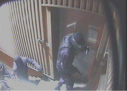 1.29am Three masked men at the depot's front door